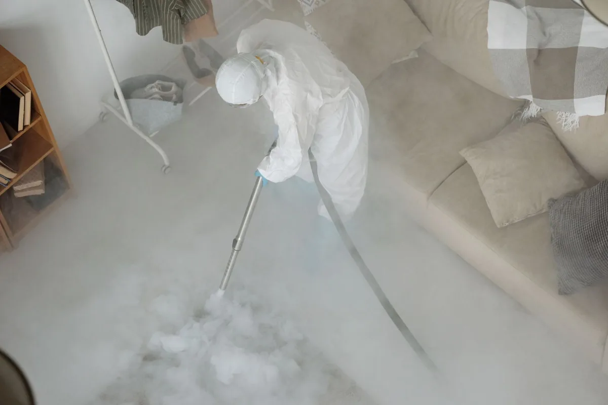 Biohazard cleanup technician in protective equipment, Lake Lorelei, OH